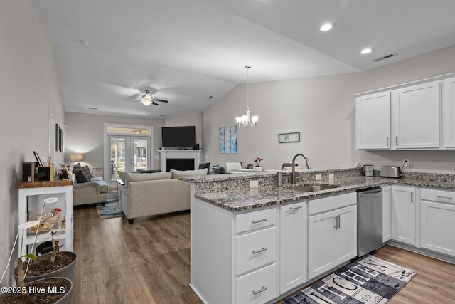 kitchen with sink, white cabinetry, and kitchen peninsula