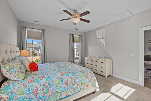 carpeted bedroom featuring ceiling fan