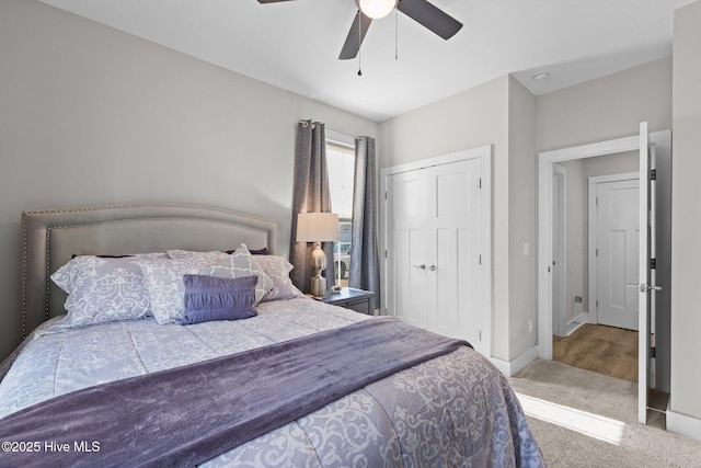 carpeted bedroom featuring a closet and ceiling fan