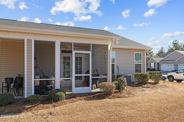 back of house with a sunroom