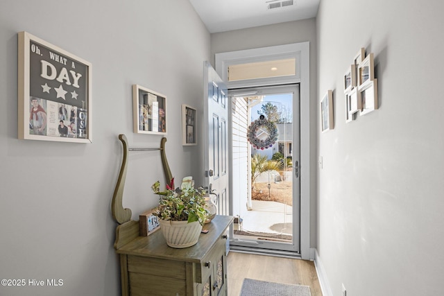 doorway featuring light hardwood / wood-style floors