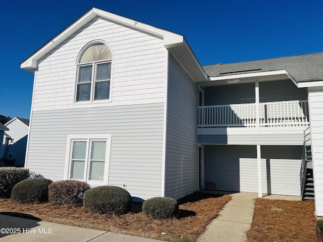 view of home's exterior featuring a balcony