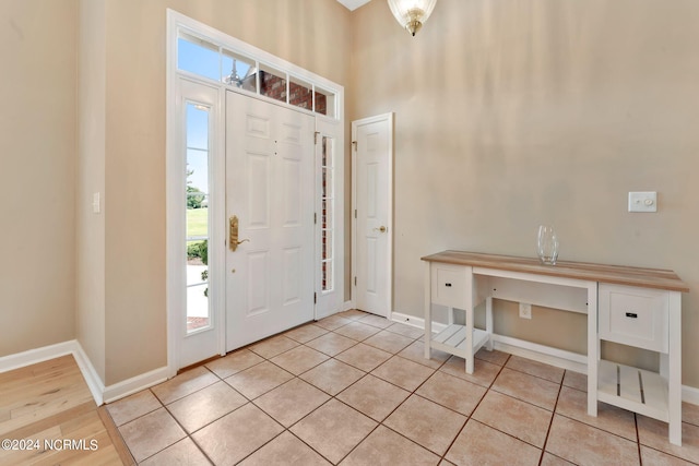 foyer entrance with light tile patterned floors