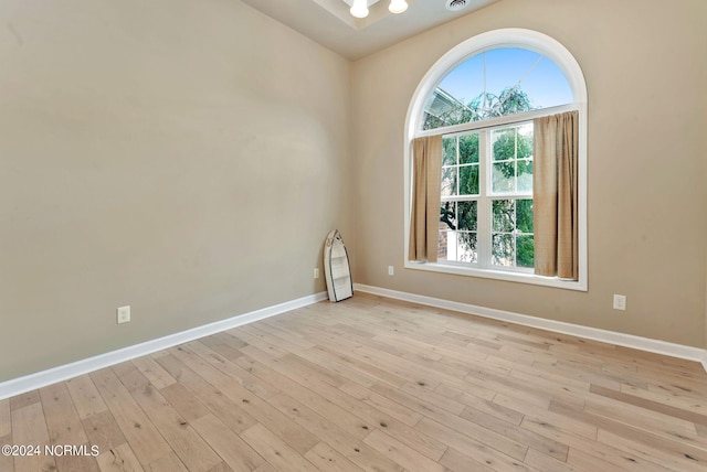 unfurnished room with light hardwood / wood-style floors