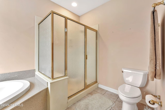 full bathroom featuring sink, plus walk in shower, toilet, and tile patterned flooring