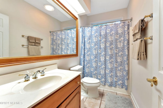 bathroom with toilet, tile patterned flooring, walk in shower, and vanity