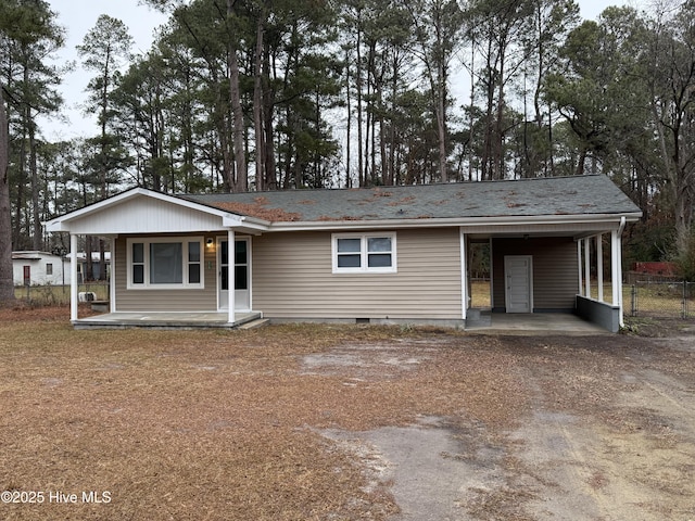 ranch-style house with a carport and covered porch