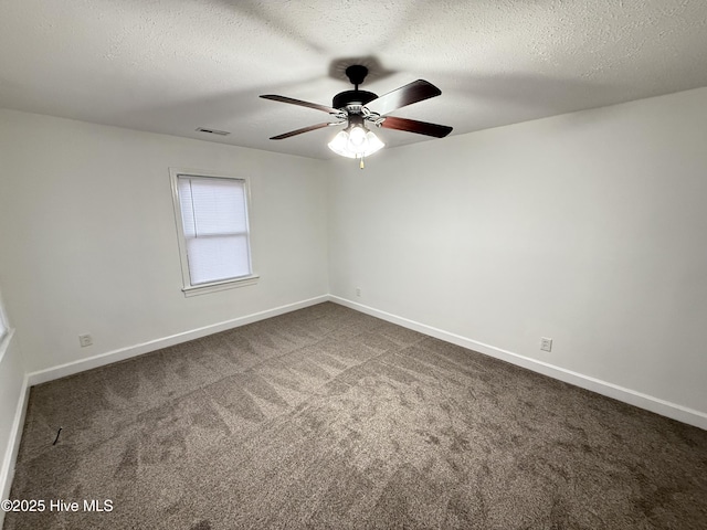 spare room with carpet floors, a textured ceiling, and ceiling fan