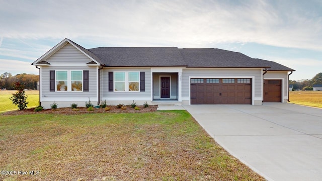 view of front of home with a garage and a front yard