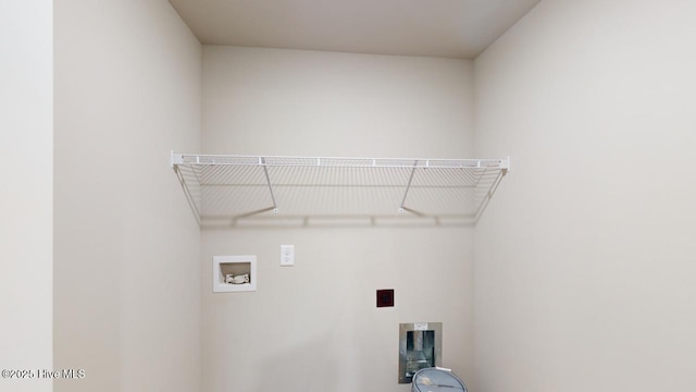 laundry area with washer hookup and electric dryer hookup