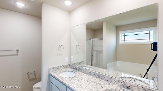 full bathroom with toilet, vanity, and independent shower and bath