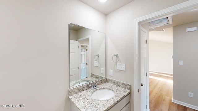 bathroom with vanity and wood-type flooring