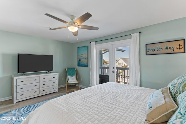 bedroom featuring access to outside, ceiling fan, french doors, and wood-type flooring