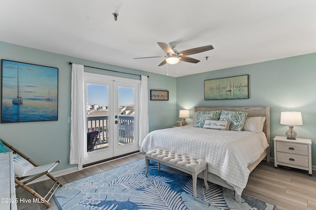 bedroom featuring ceiling fan, light hardwood / wood-style floors, and access to outside