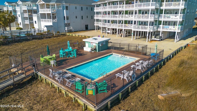 view of swimming pool with a patio area