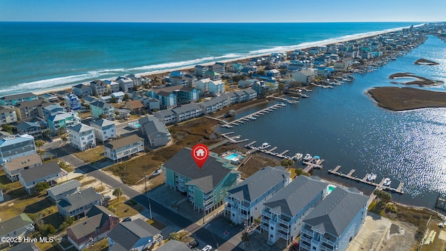 aerial view featuring a water view and a beach view