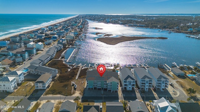 drone / aerial view featuring a view of the beach and a water view