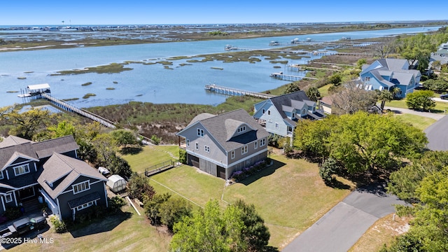 bird's eye view featuring a residential view and a water view