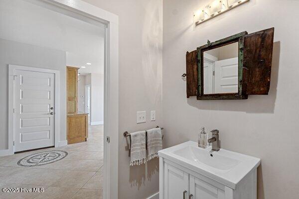 bathroom with tile patterned flooring and vanity