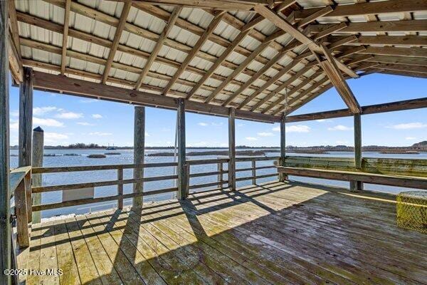 view of dock with a deck with water view