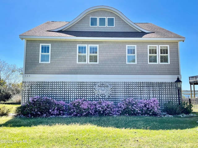 view of side of home featuring a yard