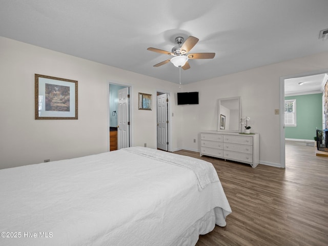 bedroom featuring dark hardwood / wood-style flooring and ceiling fan