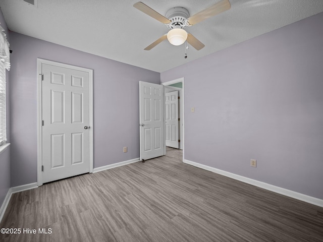 unfurnished bedroom featuring ceiling fan and light wood-type flooring