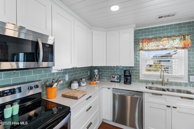 kitchen featuring sink, white cabinets, and stainless steel appliances