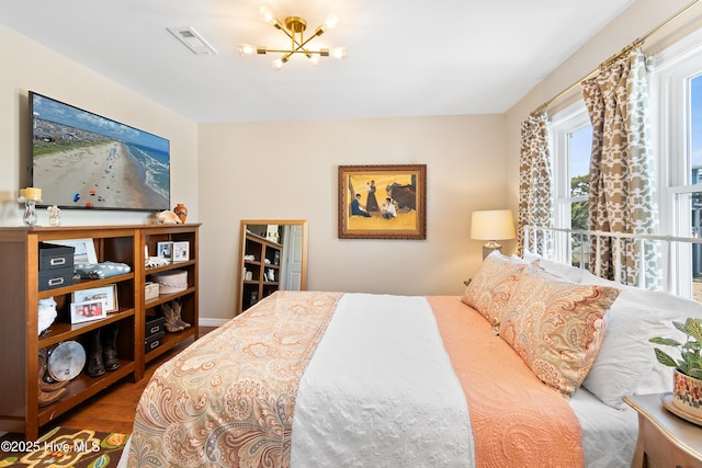 bedroom with an inviting chandelier