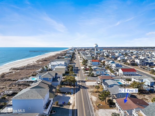 drone / aerial view with a water view and a view of the beach