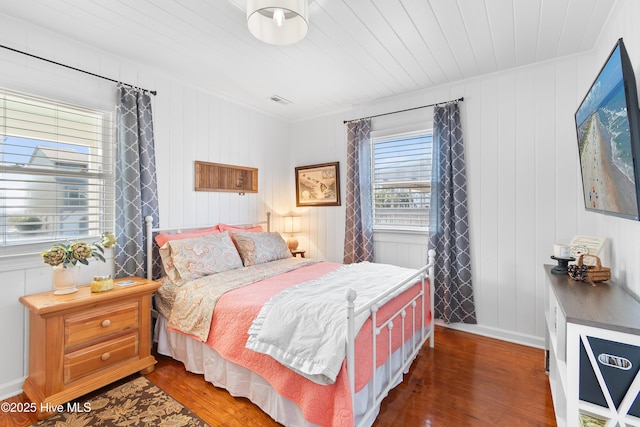 bedroom featuring dark hardwood / wood-style flooring