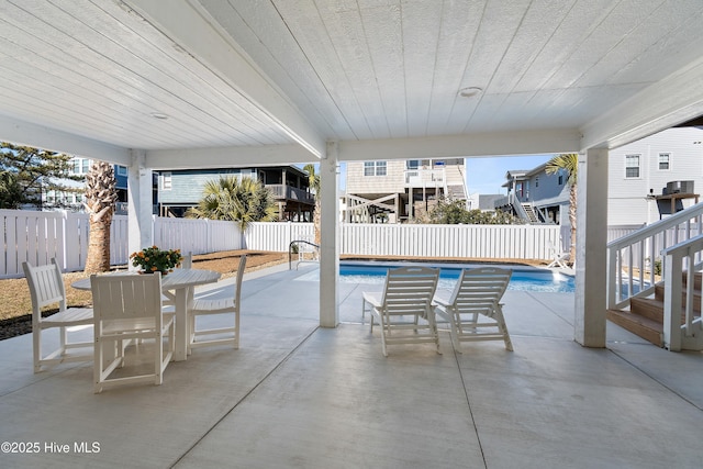 view of pool featuring central AC unit and a patio