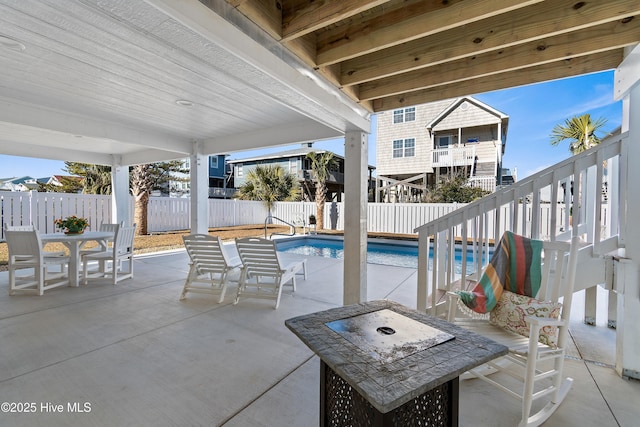 view of patio / terrace with a fenced in pool