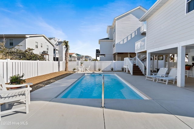 view of swimming pool with a patio area