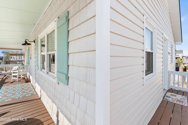 view of property exterior with covered porch