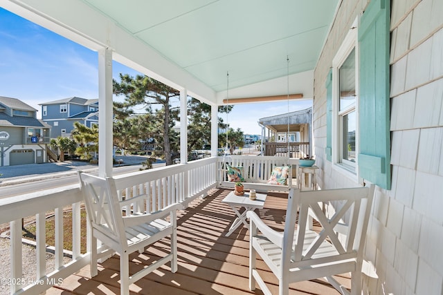 wooden terrace featuring a porch