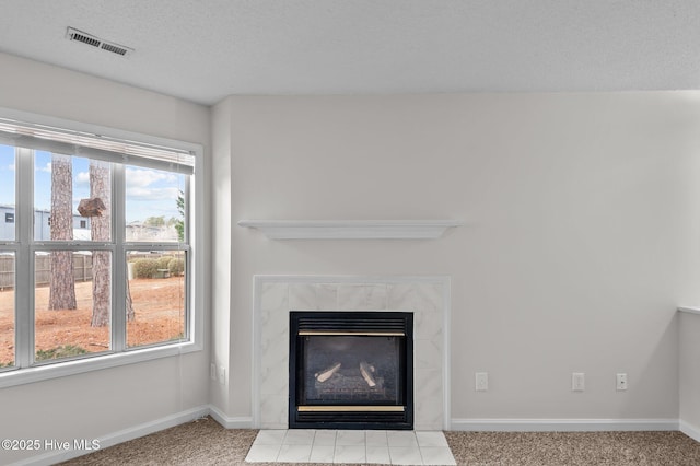 details with carpet floors and a tiled fireplace