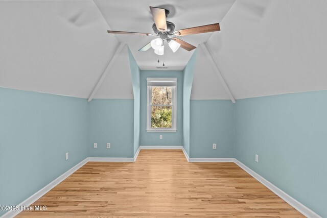 bonus room featuring ceiling fan, lofted ceiling, and light wood-type flooring