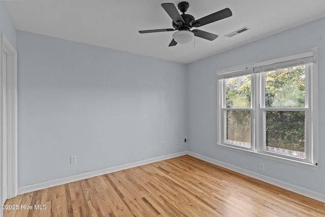 empty room with ceiling fan and light wood-type flooring