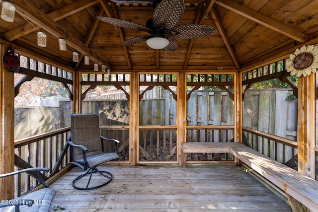 wooden terrace featuring a gazebo and ceiling fan