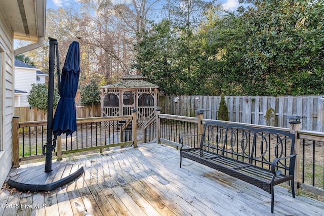 wooden deck featuring a gazebo