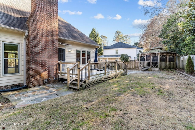 view of yard with a wooden deck and a gazebo