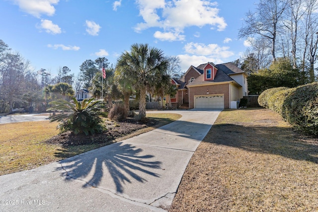 view of front of home with a garage and a front lawn