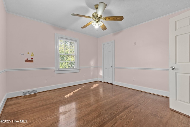 unfurnished room with ceiling fan, ornamental molding, and hardwood / wood-style floors