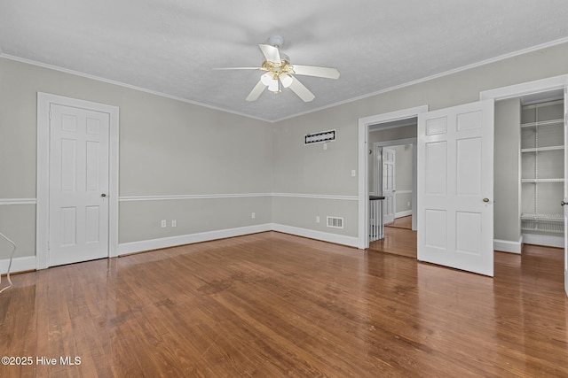 unfurnished bedroom featuring crown molding, ceiling fan, and wood-type flooring