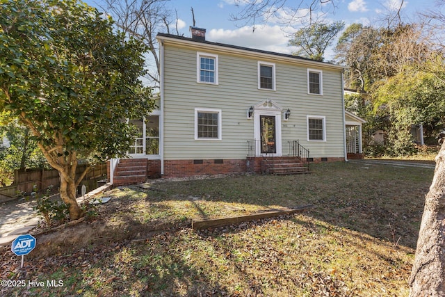 colonial inspired home with a front yard