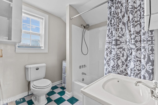 bathroom featuring lofted ceiling, toilet, and shower / washtub combination