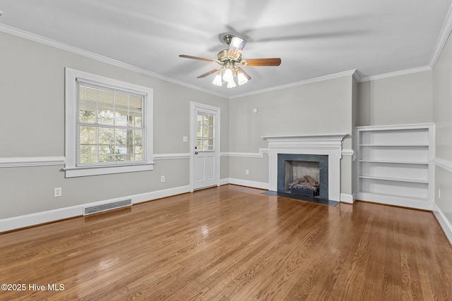 unfurnished living room with crown molding, ceiling fan, and hardwood / wood-style flooring