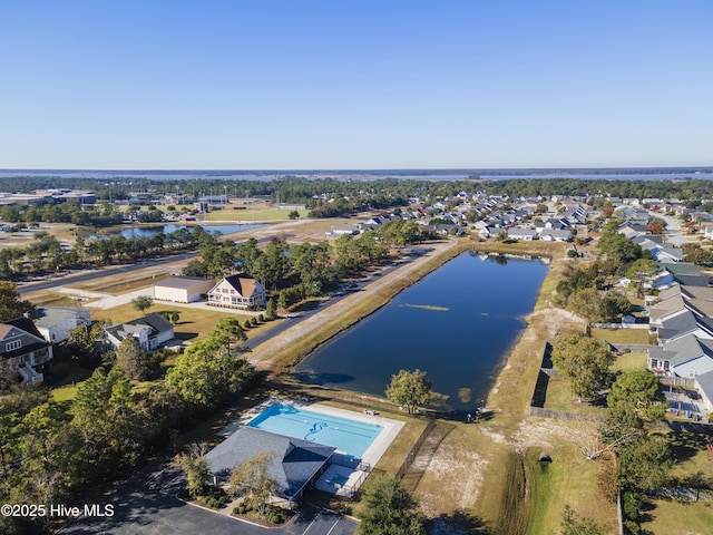 aerial view with a residential view and a water view