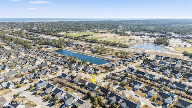 birds eye view of property featuring a residential view and a water view